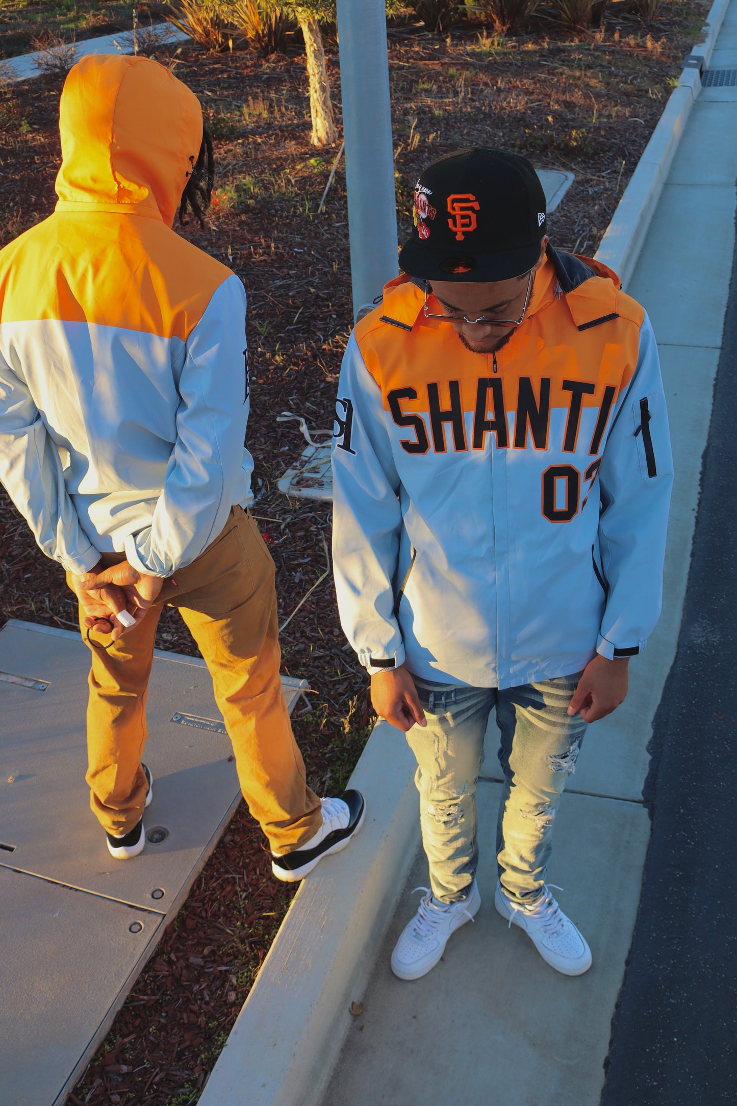 SHANTI GREY/ORANGE WINDBREAKER