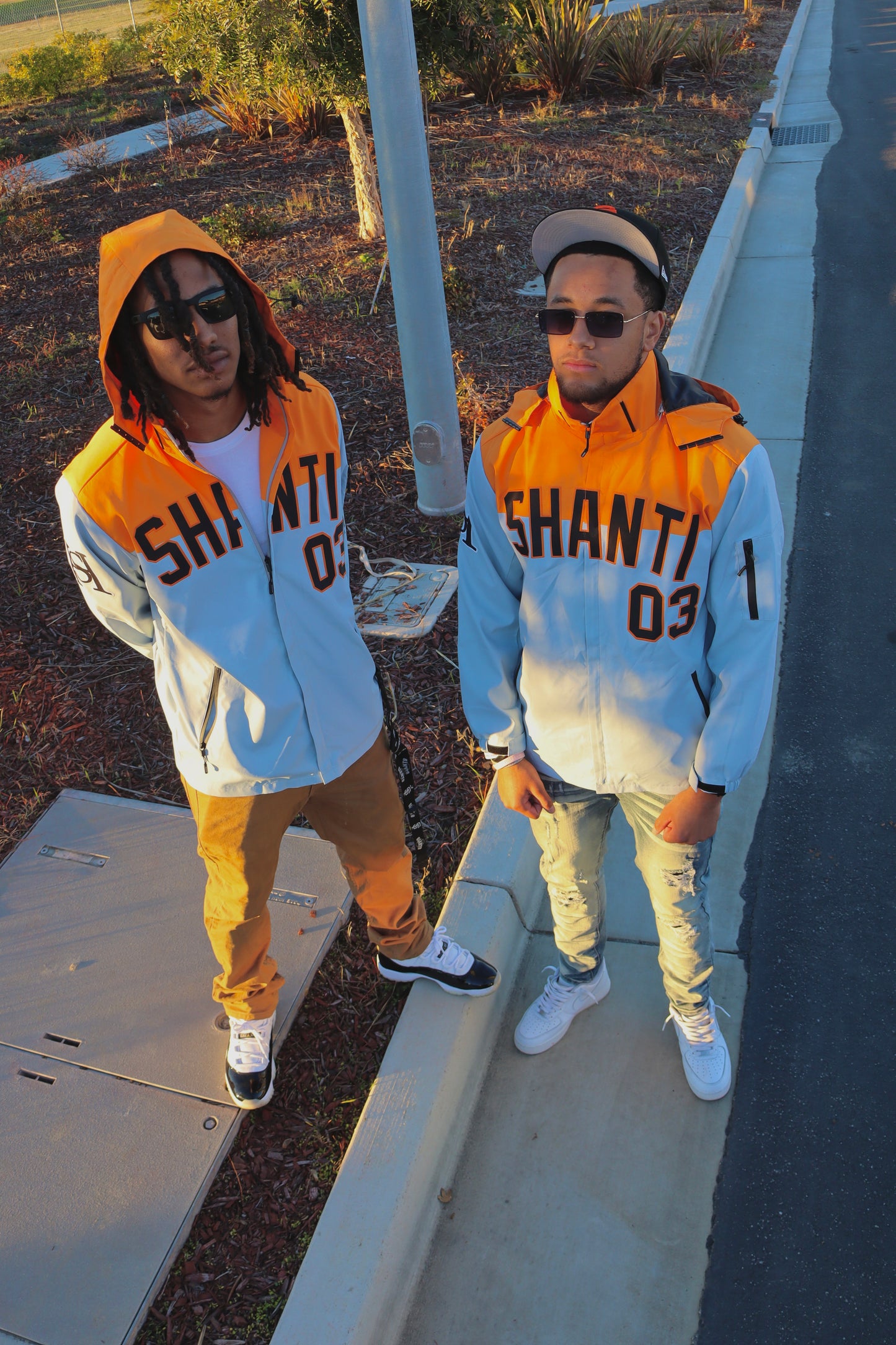SHANTI GREY/ORANGE WINDBREAKER